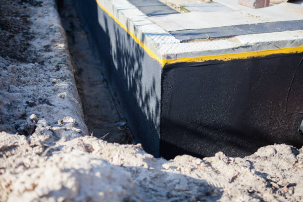 Professional Basement Waterproofing technician working in Summitville, IN